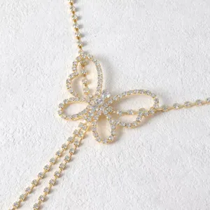 Rhinestone butterfly belly chain detail view, sparkling crystal waist jewelry accessory.
