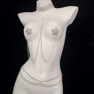 Rhinestone body chain set featuring layered waist chains and star pasties for festival wear.
