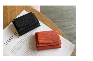 Mini trifold leather wallet detail view showing compact card slots and coin pocket design.