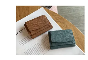 Minimalist genuine leather short trifold wallet for women, compact mini coin purse daily use.