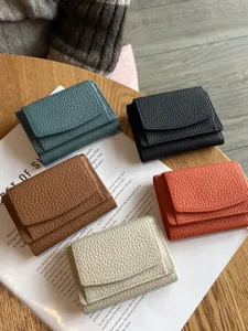 Minimalist genuine leather trifold wallet for women, compact mini coin purse with card slots.