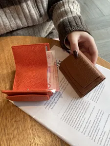 Compact genuine leather trifold wallet for women with card slots and coin pocket, mini purse.