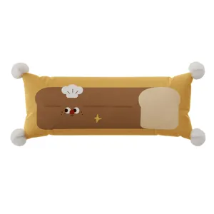 Cartoon bread long bolster pillow with white pom poms for living room sofa and bed support.