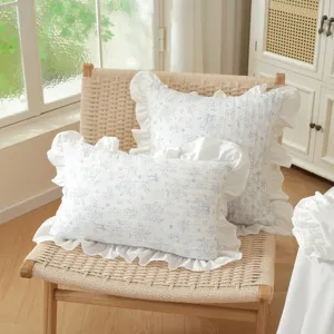 French pastoral style floral cotton decorative pillow cover with delicate white ruffles.