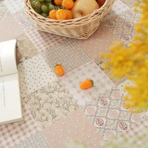 Cotton patchwork tablecloth with floral and polka dot design for dining table and coffee table decor.