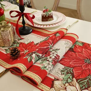Detailed view of Christmas jacquard table runner featuring festive red poinsettia floral design.