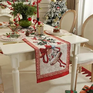 Christmas jacquard table runner with festive bell and bow design for holiday home decor.