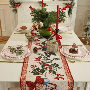 Detailed view of Christmas table runner, elegant jacquard holly and bow design, festive dining decor.