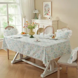 Pastoral floral cotton jacquard tablecloth detail showing ruffles and cute pom-pom trim.
