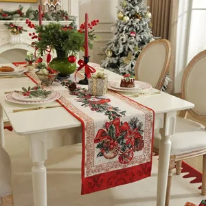 Christmas table runner detail showing festive jacquard floral pattern in red and green hues.