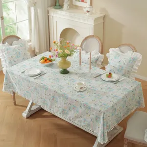 Pastoral style 100% cotton jacquard floral tablecloth with cute ruffles and pom poms for dining.