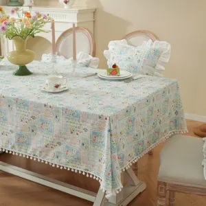 Countryside pastoral style cotton jacquard tablecloth with cute pom-pom trim and floral print.