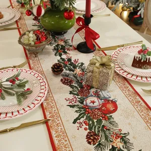 Detailed view of Christmas themed jacquard table runner with festive pine cones and red ornaments.