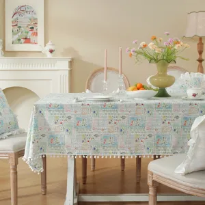 Pastoral cotton floral tablecloth with cute pom-pom trim for dining table and home decor.