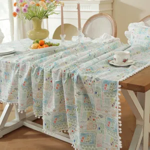 Pastoral floral cotton jacquard tablecloth with cute pom-pom fringe for dining table decor.