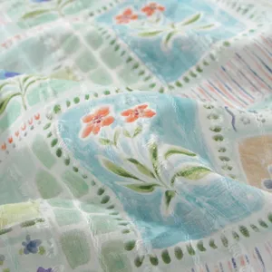 Pastoral style floral printed cotton fabric close-up, soft texture and fresh design details.