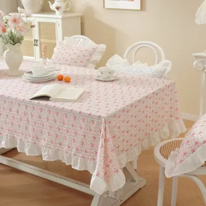 Detail view of the pastoral style cotton tablecloth with pink bow pattern and cute ruffles.