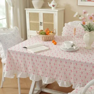 Pink floral bow tablecloth with white ruffles, pastoral style cotton fabric table cover detail.