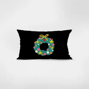 Coussin décoratif rectangulaire noir avec un joli détail graphique de couronne de Noël.