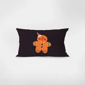 Coussin rectangulaire foncé de décoration avec un joli graphique de bonhomme en pain d'épices.