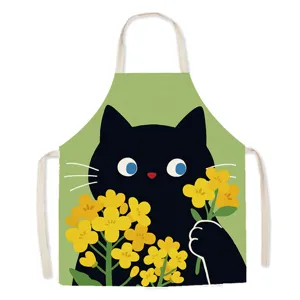 Detailed view of the cute black cat and rapeseed flower printed apron, ideal for kitchen cooking.