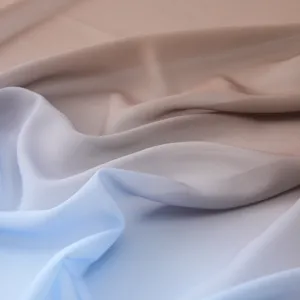 Close-up detail of soft gradient pearl chiffon scarf fabric showing texture and drape