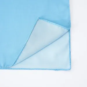 Close-up detail of light blue pearl chiffon scarf showing the neat hemmed edge fabric texture