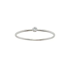 Minimalist silver-toned thin band ring featuring a single sparkling round lab diamond.