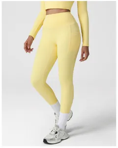 Women's high waist yoga leggings with side pocket and long sleeve crop top fitness set.