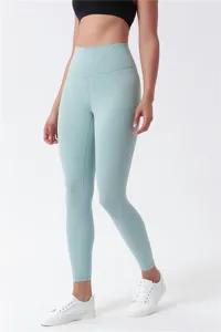 Detail view of high-waisted yoga pants showing tight fit, skin-friendly fabric and lifting seam.