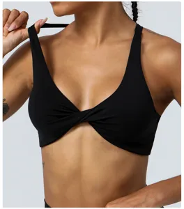 Black twist front sports bra, moisture-wicking activewear for yoga, gym and fitness.