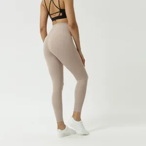 High-waist yoga pants detail view, showing back shape, butt-lifting cut and soft naked fabric.