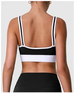 Vue arrière détaillée d'un soutien-gorge de sport bicolore noir et blanc avec bretelles.