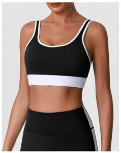 Vue rapprochée de la brassière de sport noir et blanc, col en U, élastique et séchage rapide.