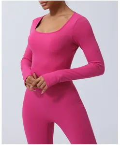 Close-up detail of women long sleeve fitness jumpsuit, pink athletic bodysuit for yoga gym training.
