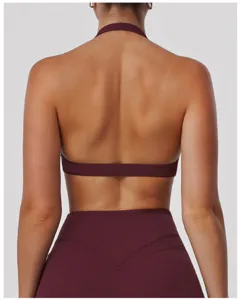 Back view detail of maroon halter sports bra showing hollow back and breathable fabric design.