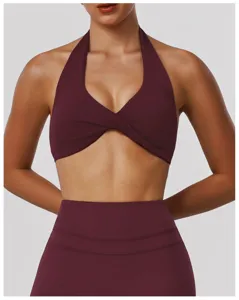 Burgundy halter yoga bra detail shot, featuring stylish front twist and high support fit.