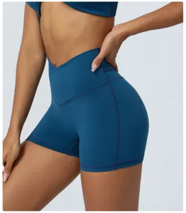 High waist crossover fitness yoga shorts for women, stretchy peach lift gym running pants.