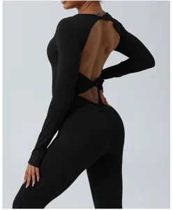 Black long sleeve backless yoga jumpsuit for women, breathable fitness activewear and workout romper.