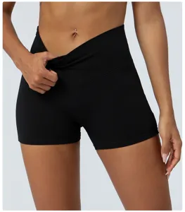 Detail view of black high waist crossover yoga shorts, showcasing stretch and tummy control.