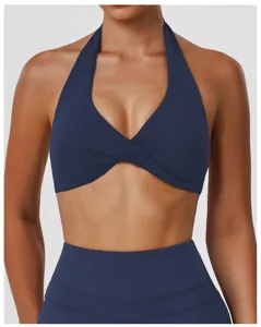Detailed view of dark blue halter cross yoga sports bra with removable pads for fitness running.
