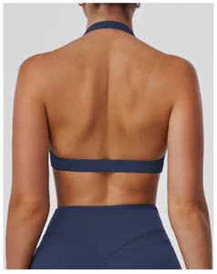 Back view of a solid dark blue halter yoga sports bra and leggings set for fitness workout.