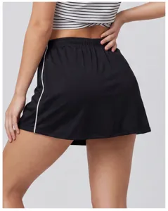 Black athletic sports skort skirt side white piping detail view for tennis and yoga activewear