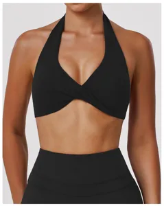 Close-up detail of black crossover halter sports bra, perfect for yoga and fitness.