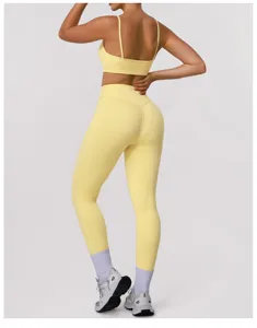Back detail of women yellow athletic sports bra and high waist fitness leggings set.