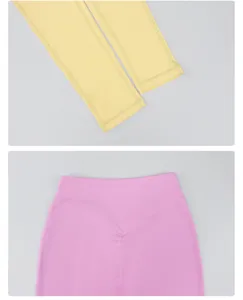Dettagli in primo piano di leggings yoga a vita alta con cucitura a V e polsini elastici.