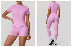 Pink seamless fitness activewear detail, high waist leggings and short sleeve top view.