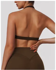 Back view detail of brown halter yoga bra, cutout athletic tank top for fitness training.