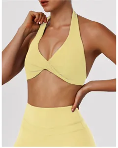 Yellow halter yoga bra with twist front design, perfect for fitness, gym and running.