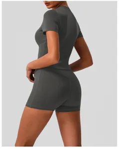 Back view detail of dark grey women athletic short sleeve top and high waist fitness shorts set.